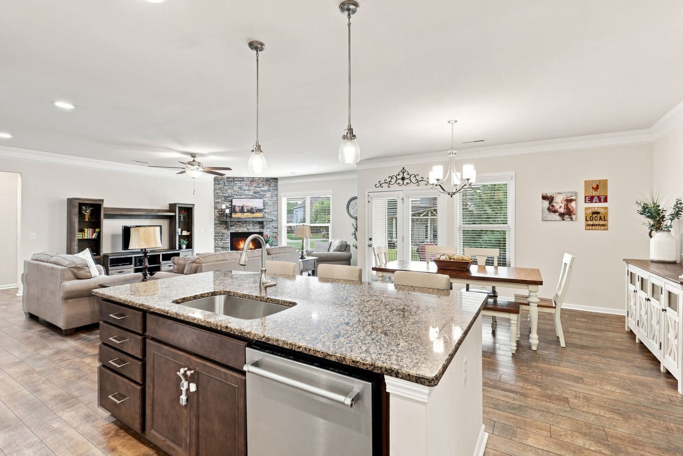 From the kitchen sink in the island, the sightline runs straight through the family room.